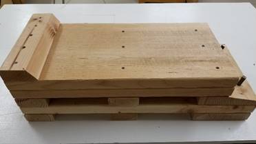 A wooden box

Description generated with high confidence